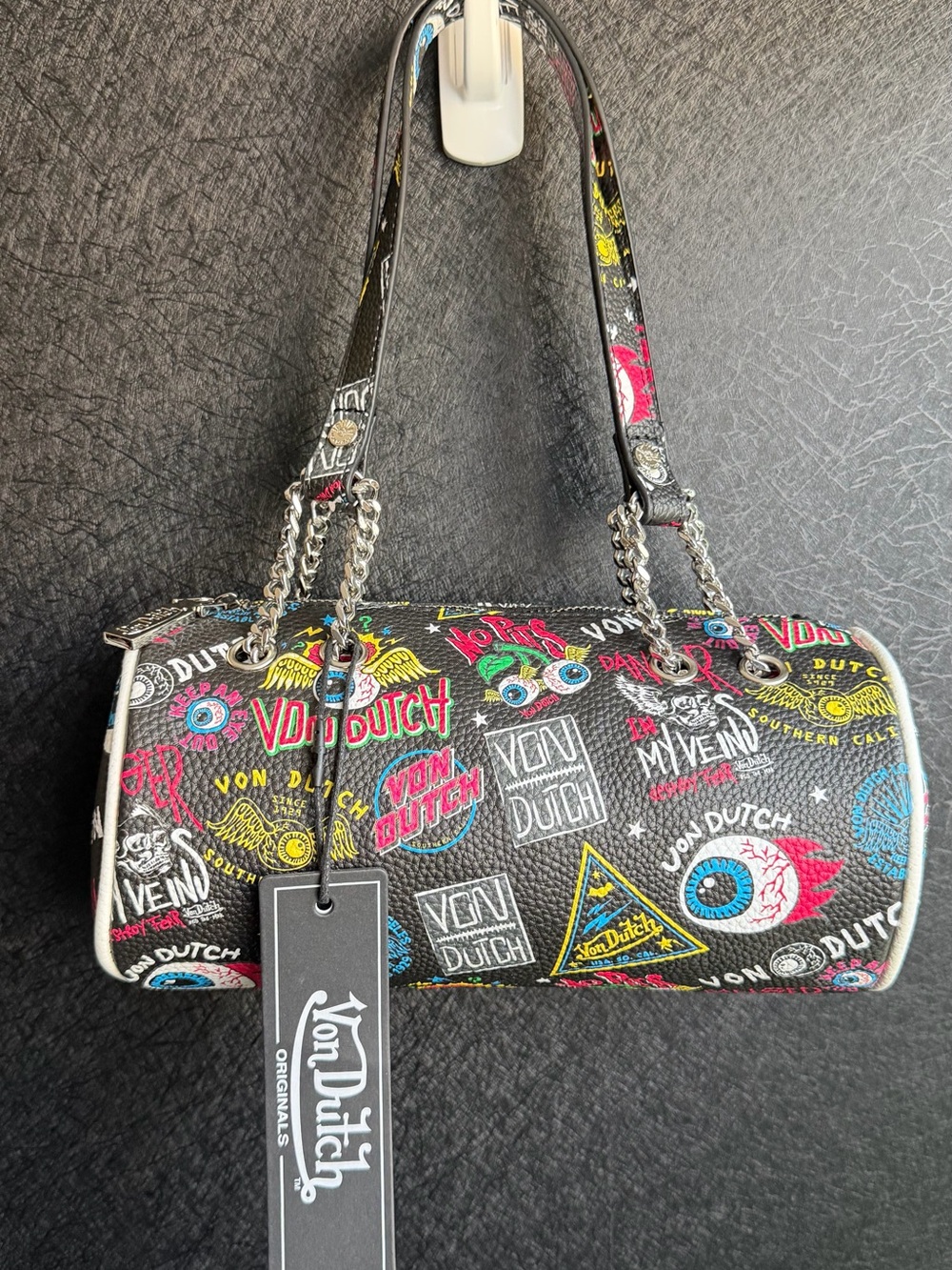 Von Dutch Black Barrel Shoulder Barrel Bag with Pink, Yellow & Blue Graphics